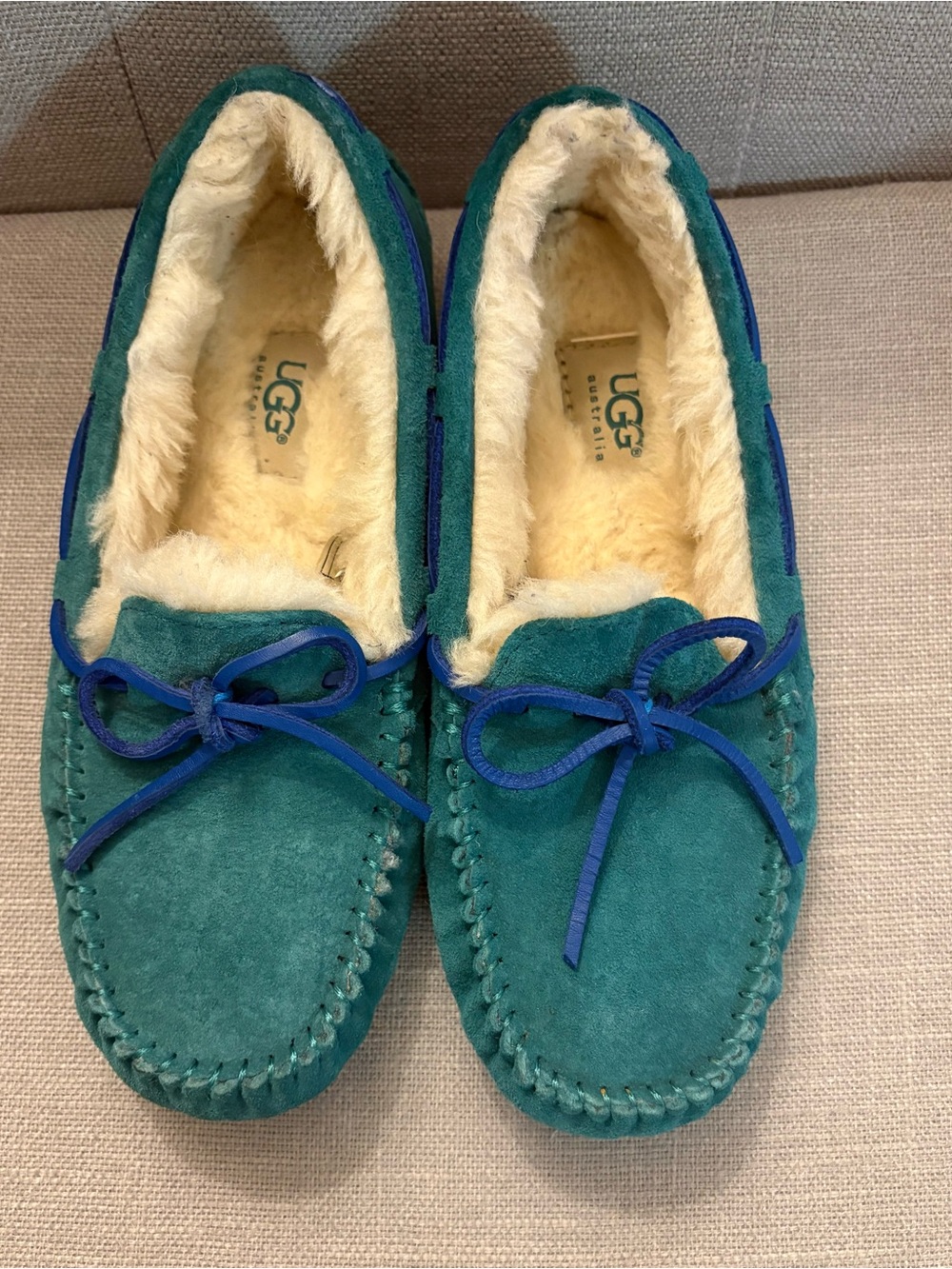 UGG woman’s Teal Suede Shearling Moccasins with Blue Bow